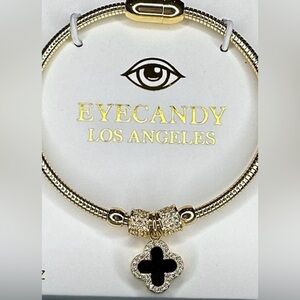 Eye Candy fashion Gold and Black Bracelet with iconic cross charm new in box NWT